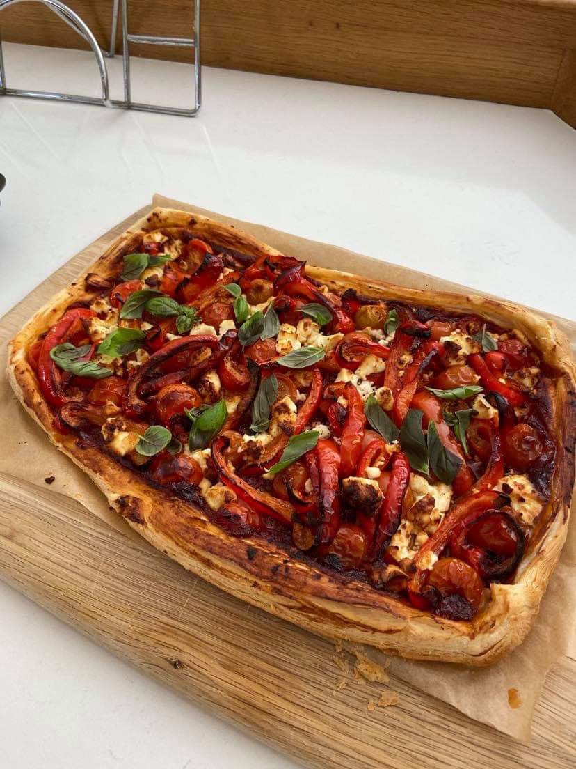 Red Pepper and Goats Cheese Tart on a woodern board