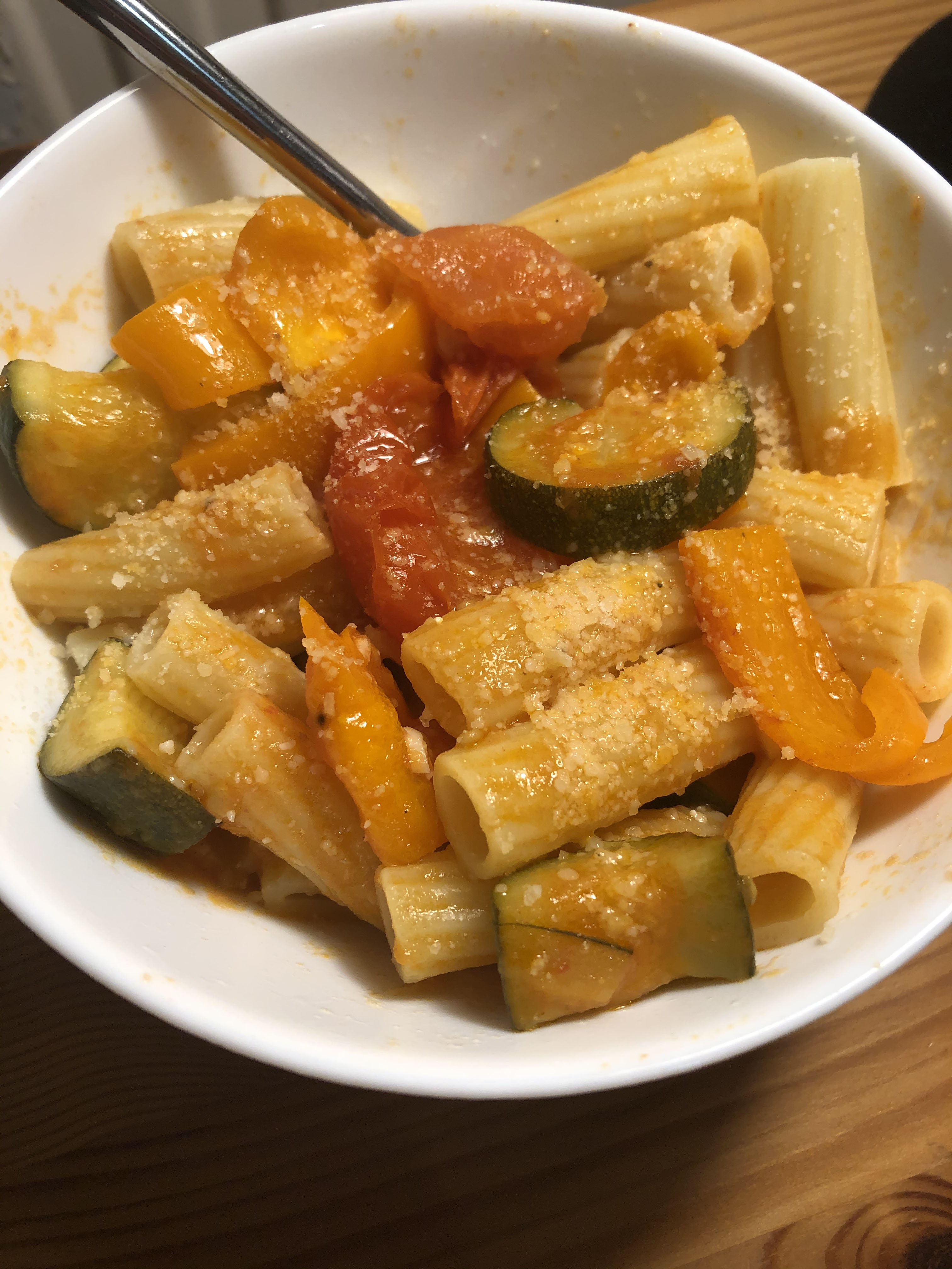 Bowl of rigatoni with a sprinkling of Parmigiano-Reggiano